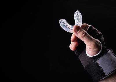 How do you attach a Shock Doctor mouthguard to lacrosse helmet?