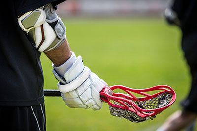 How do you wear lacrosse gloves?